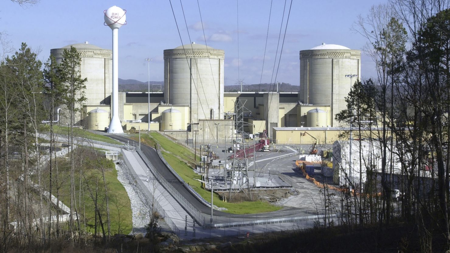FILE - This Saturday, Jan. 8, 2005 file photo shows Oconee Nuclear Station in Seneca, S.C.  A driver tried to crash through the exit gates of a South Carolina nuclear plant Thursday, Nov. 2, 2023 about an hour after security asked the same car to leave when it tried to enter, authorities said.(AP Photo/Mary Ann Chastain, File)