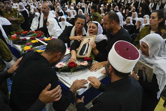 Mourners gather around the coffin of Druze Israeli Lieutenant colonel Salman Habaka in the village of Yanuh Jat, northern Israel, on November 3