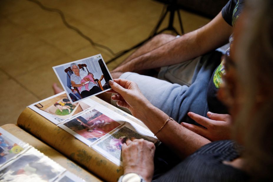 Neta Heiman, a peace activist, holds a photograph of her mother, Ditza Heiman, who is being held hostage by Hamas, in Haifa, Israel on Thursday, November 2.