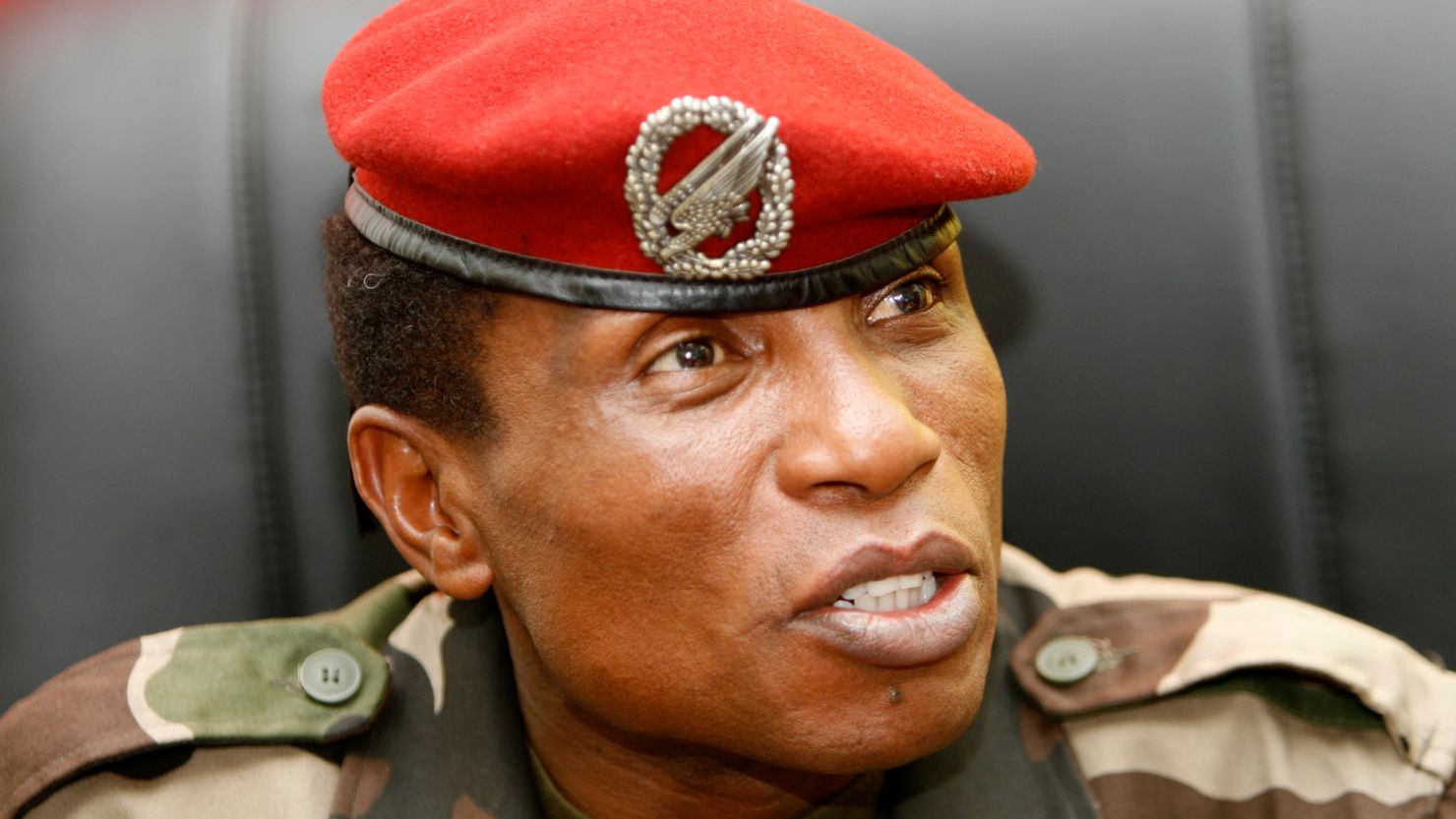 Captain Moussa Dadis Camara, chief of the ruling junta, speaks to journalists in his office at the military camp Alpha Yaya in Conakry October 1, 2009. Guinean opposition leaders rejected on Thursday the ruling junta's offer of a national unity government and called for foreign intervention to prevent more bloodshed after the killing of protesters on Monday. Junta chief Camara, facing the threat of international sanctions after security forces killed scores of anti-government protesters, wants to ease tensions in the world's biggest exporter of the aluminium ore bauxite.