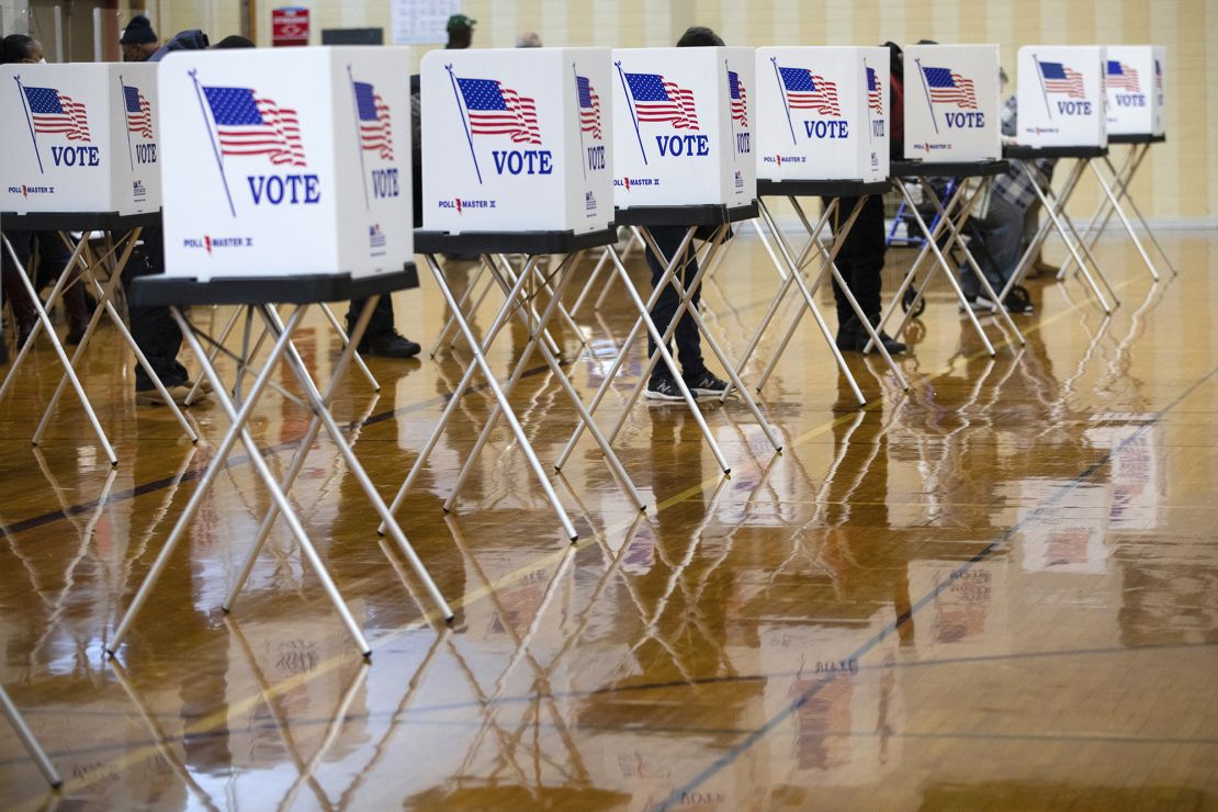 Voters cast ballots at a polling location in Southfield, Michigan, U.S., on Tuesday, Nov. 3, 2020. American voters, at least those who've not yet cast ballots, go to the polls Tuesday to choose between President Donald Trump and Democratic nominee Joe Biden and cast votes in U.S. House and Senate races and state and local elections.