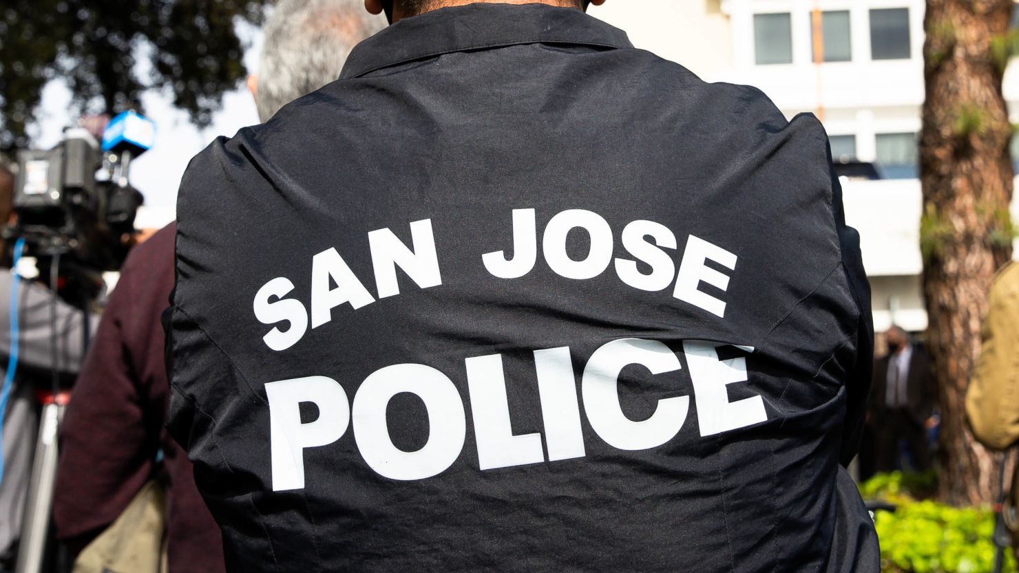 SAN JOSE - MARCH 17: A person wears a San Jose Police jacket during a press conference outside of the San Jose Police department in San Jose, Calif., on Wednesday, March, 17, 2021. (Photo by Randy Vazquez/MediaNews Group/The Mercury News via Getty Images)