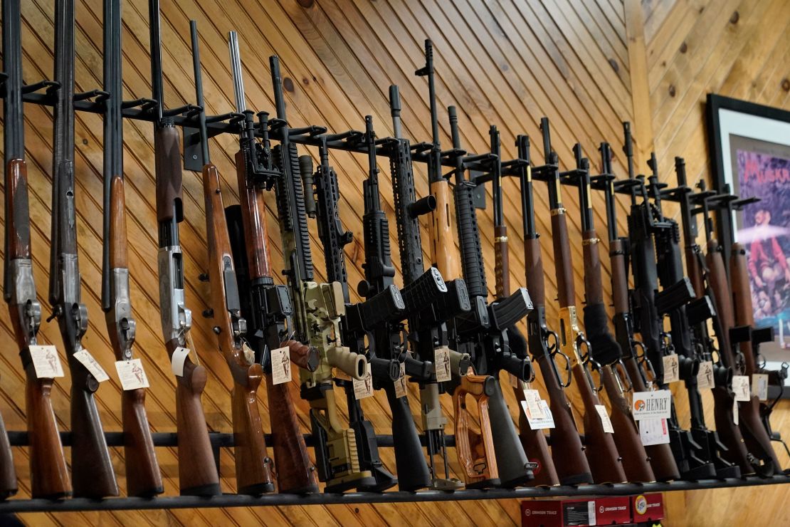 Various guns are displayed at a store on July 18, 2022, in Auburn, Maine.