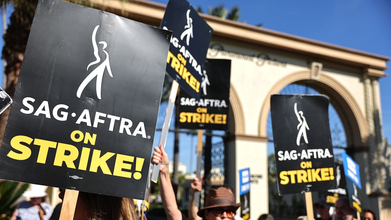 SAG-AFTRA member Caryn West (C) and other members and supporters picket outside Paramount Studios on day 113 of their strike against the Hollywood studios on November 3, 2023 in Los Angeles, California. Contract negotiations between the actors union and the Alliance of Motion Picture and Television Producers (AMPTP) are continuing in the strike which began on July 14.