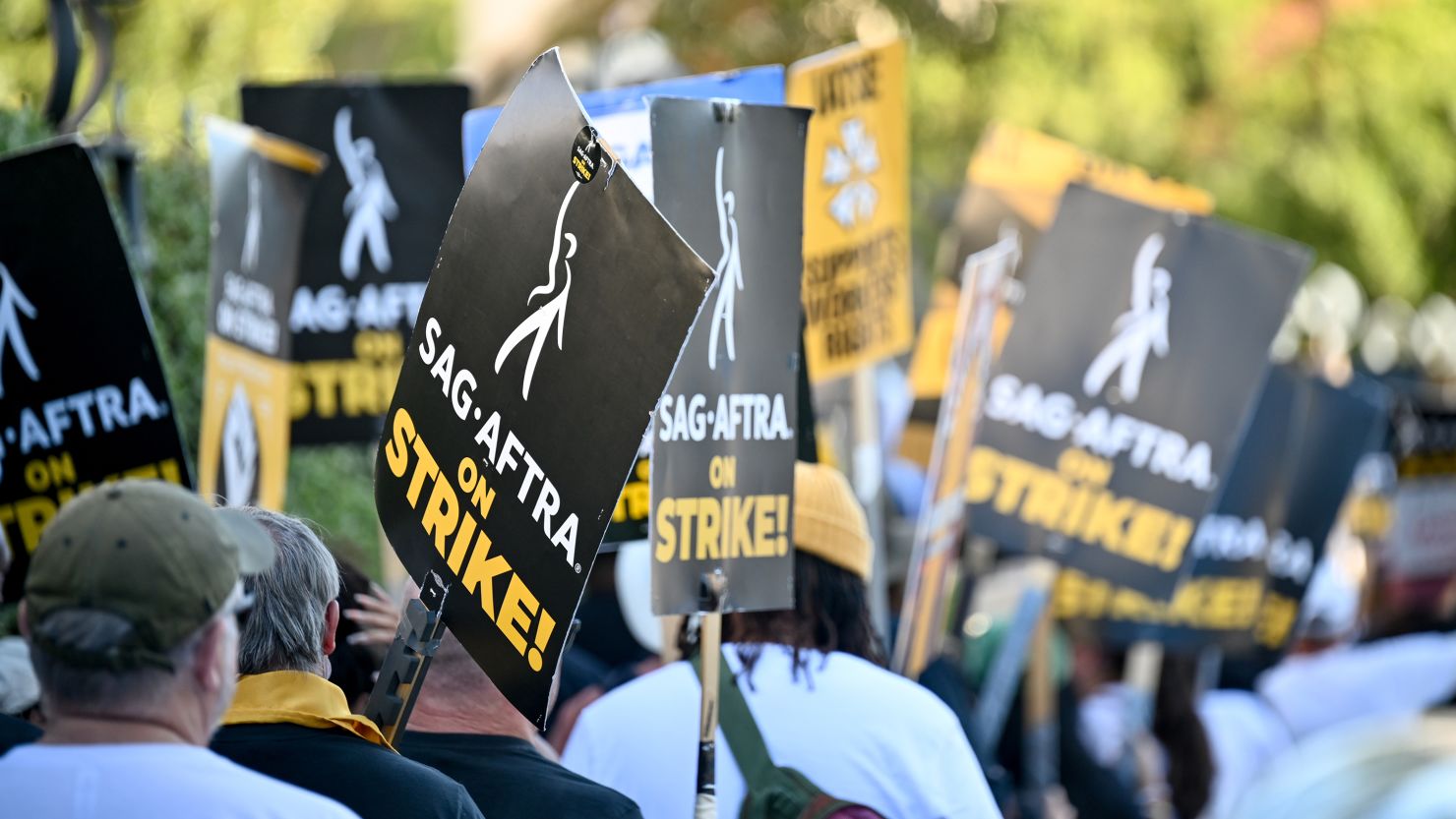 Members of SAG-AFTRA walk in protest at the SAG-AFTRA Strike at Walt Disney Studios on November 1, 2023 in Burbank, California.