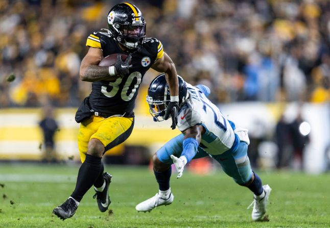 Pittsburgh Steelers running back Jaylen Warren evades Tre Avery of the Tennessee Titans on Thursday, November 2. The Steelers beat the Titans 20-16.