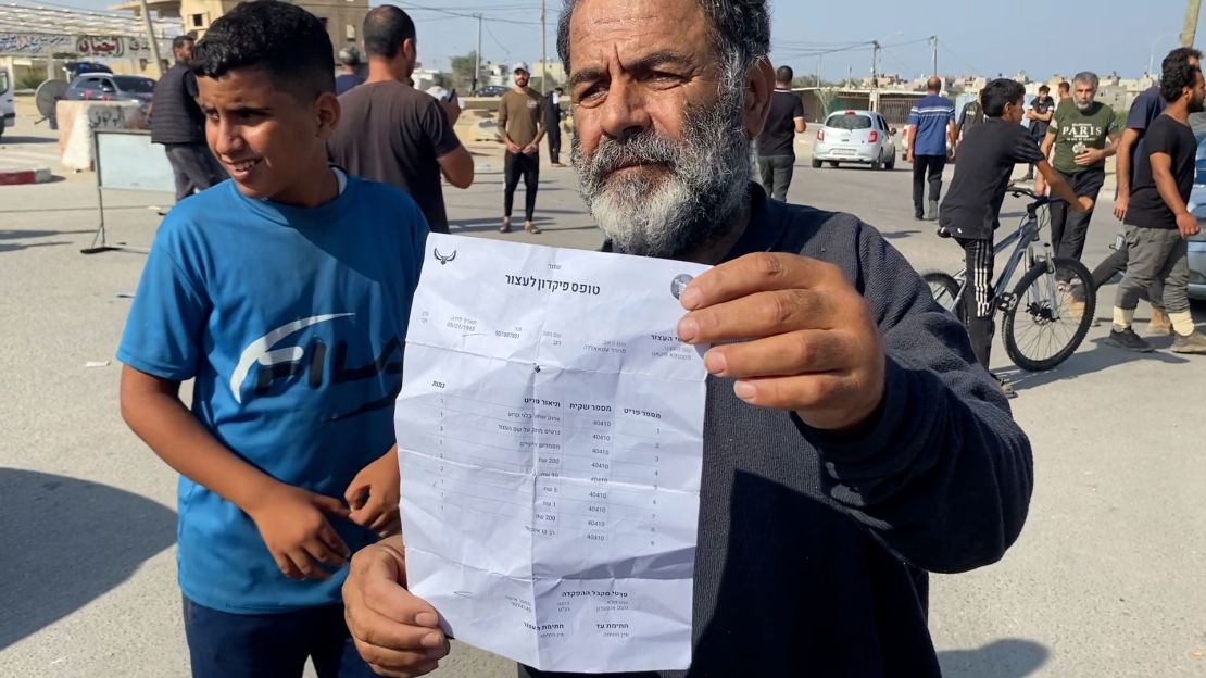Mohamed Atallah shows a list of his possessions he says were confiscated and not returned by Israeli authorities.
