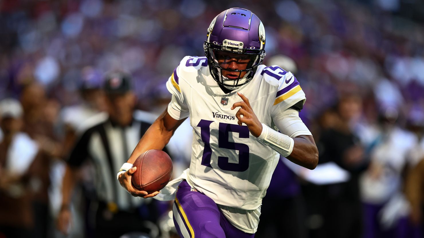 Joshua Dobbs #15 of the Minnesota Vikings carries the ball for a touchdown during the third quarter of an NFL football game against the Atlanta Falcons at Mercedes-Benz Stadium on November 5, 2023 in Atlanta, Georgia.