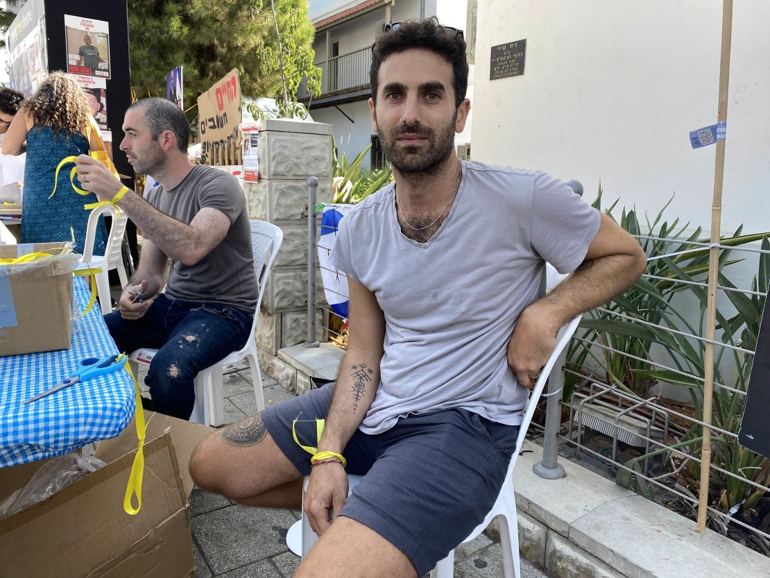 Yoav Peled, who was handing out yellow ribbons to people passing by a gathering spot for supporters of the hostages in Tel Aviv, is pictured on Thursday, November 2.