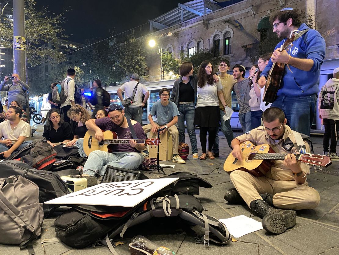 Yonatan Rapaport, center, plays guitar at a gathering of young Israelis in Jerusalem on Thursday, November 2.