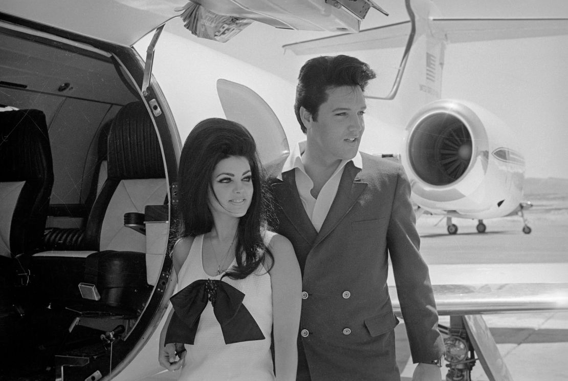 Newlyweds Elvis and Priscilla Presley, who met while Elvis was in the Army, prepare to board their private jet following their wedding at the Aladdin Resort and Casino in Las Vegas. 1967
