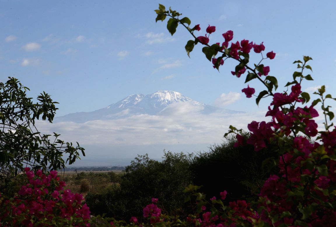 <strong>Kilimanjaro National Park, Tanzania --</strong> Mount Kilimanjaro and its surrounding landscape make up the national park which became a UNESCO site in 1987. The area is home to an abundance of wildlife, from leopards to flamingos, which have come <a href="https://whc.unesco.org/en/list/403/" target="_blank" target="_blank">under threat</a> due to climate change.