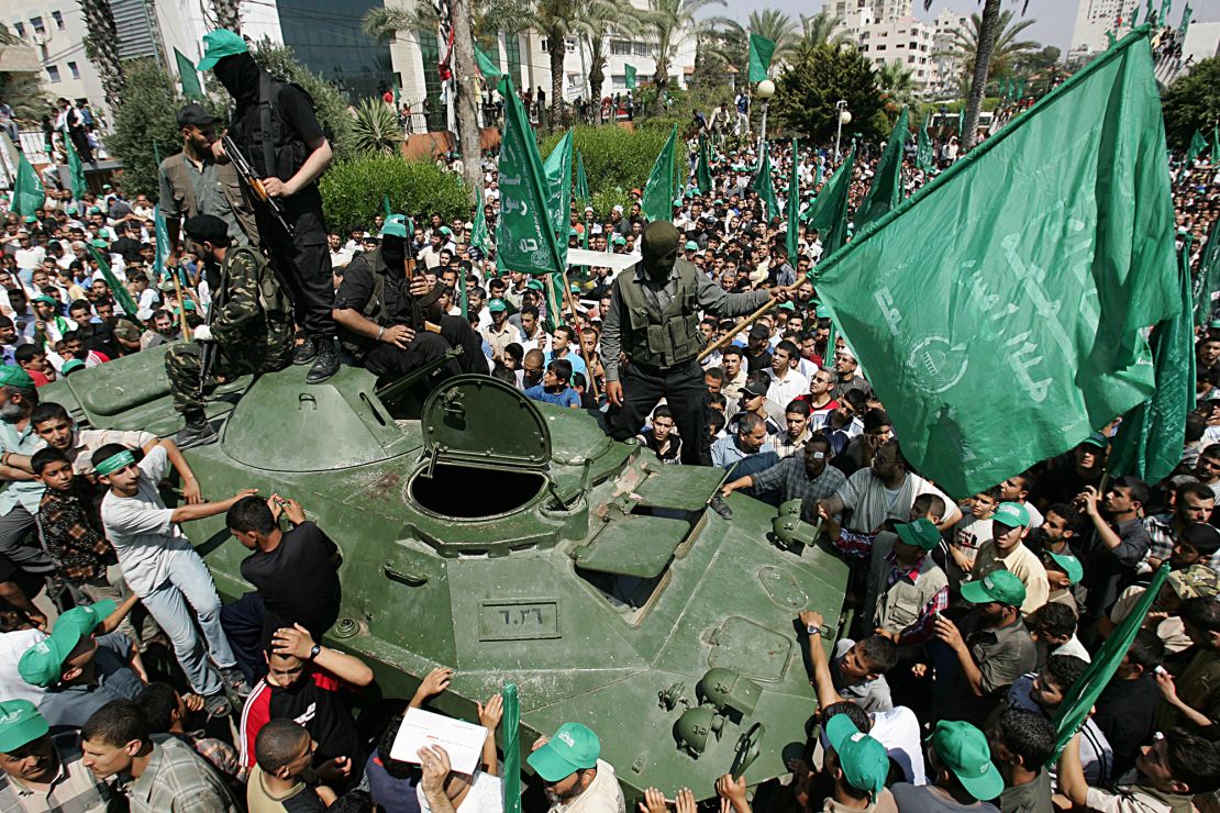 GAZA CITY, GAZA STRIP - JUNE 15:  Palestinian Hamas members ride an armored vehicle siezed from Fatah during a celebration rally June 15, 2007 in Gaza City, Gaza Strip. After Hamas effectively took over the Gaza Strip June 14, they now control the police and security and will take up positions at the Gaza crossings. Palestinian President Mahmoud Abbas dissolved the unity government with Hamas and declared the formation of an emergency government. (Photo by Abid Katib/Getty Images)