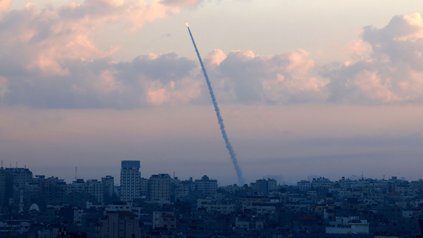 TOPSHOT - Rockets are fired from Gaza City towards Israel on October 7, 2023. Dozens of rockets were fired from the blockaded Gaza Strip towards Israel on October 7, 2023, an AFP journalist in the Palestinian territory said, as sirens warning of incoming fire blared in Israel. (Photo by MAHMUD HAMS / AFP) (Photo by MAHMUD HAMS/AFP via Getty Images)