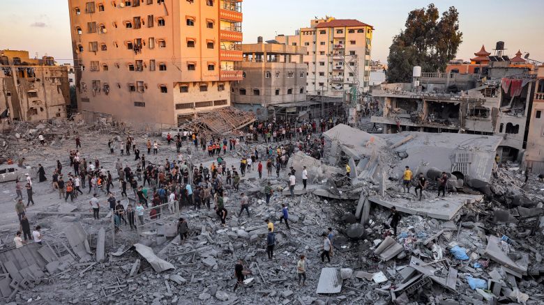 People search rubble for survivors and the bodies of victims in the aftermath of Israeli bombardment in Rafah in the southern Gaza Strip on November 6, 2023, amid continuing battles between Israel and the Palestinian militant group Hamas. (Photo by Mohammed ABED / AFP) (Photo by MOHAMMED ABED/AFP via Getty Images)