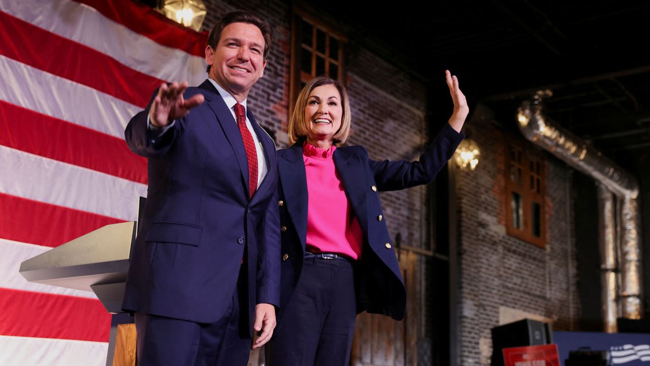 Florida Governor and U.S. Presidential candidate Ron DeSantis and Iowa Governor Kim Reynolds gesture as Reynolds endorses DeSantis's bid to be the Republican nominee in the 2024 presidential race at a rally, in Des Moines, Iowa, U.S. November 6, 2023.  REUTERS/Rachel Mummey