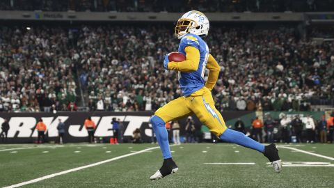 EAST RUTHERFORD, NEW JERSEY - NOVEMBER 06: Derius Davis #12 of the Los Angeles Chargers returns a punt for a touchdown during the first quarter against the New York Jets at MetLife Stadium on November 06, 2023 in East Rutherford, New Jersey. (Photo by Dustin Satloff/Getty Images)