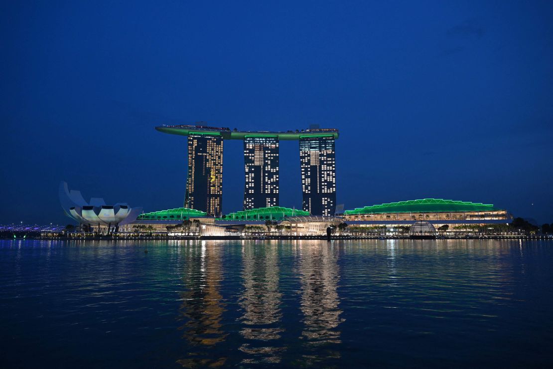 The Marina Bay Sands hotel resort is seen lit up in green to celebrate the Earthshot Prize and United for Wildlife, in Singapore on November 6, 2023. The Prince of Wales is visiting Singapore to attend the Earthshot Prize 2023 that aims to reward innovative efforts to combat climate change. The ceremony will take place on November 7. (Photo by Mohd RASFAN / AFP) (Photo by MOHD RASFAN/AFP via Getty Images)
