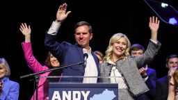 Gov. Andy Beshear waves with wife Britainy Beshear, right and Lt. Gov. Jacqueline Coleman, at left, after winning a second term as Kentucky's Governor Tuesday, November 7, 2023.