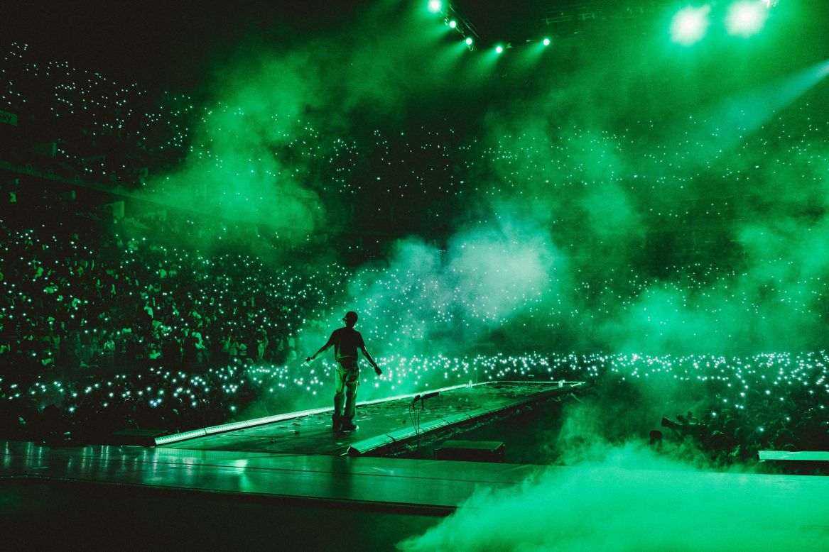 Nigerian American photographer Oliver D. Akinfeleye, known professionally as DrDrummerD, was born and raised in New York and began documenting Afrobeats in the US in 2017 as the music genre took the world by storm. Pictured: Nigerian artist Wizkid looks out at the crowd at one of three nights at the O2 Arena, London in November 2021.