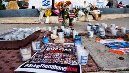 Flowers and candles are left at a makeshift shrine placed at the scene of a Sunday confrontation that lead to death of a demonstrator, Tuesday, November 7, 2023, in Thousand Oaks, Calif.