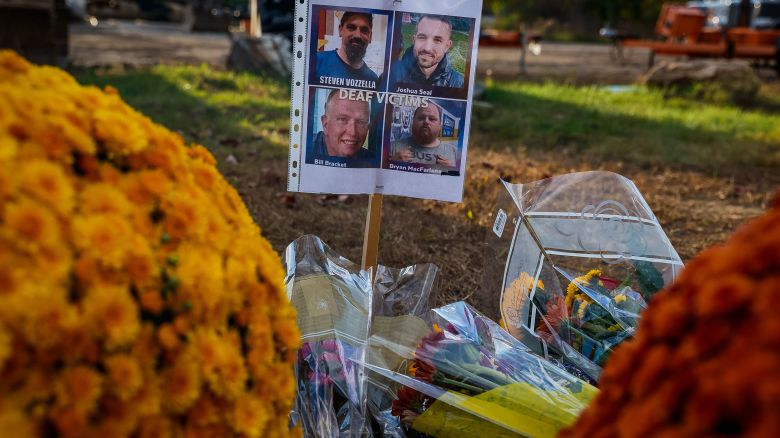 LEWISTON, ME - October 28: Photos of members from the deaf community who were killed at Schemengees Bar and Grill are placed nearby the bar, alongside flowers. (Photo by Erin Clark/The Boston Globe via Getty Images)