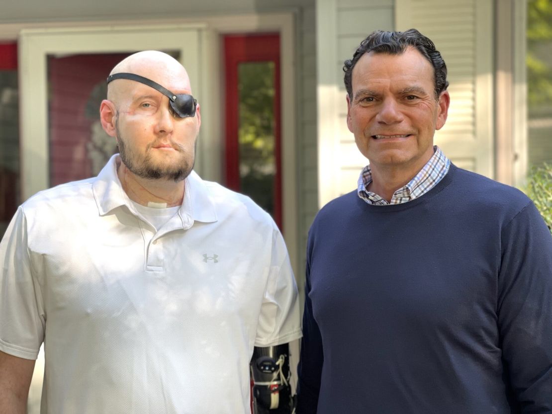 Aaron James, 46, with surgeon Dr. Eduardo Rodriguez, who performed his whole-eye and partial face transplantation.