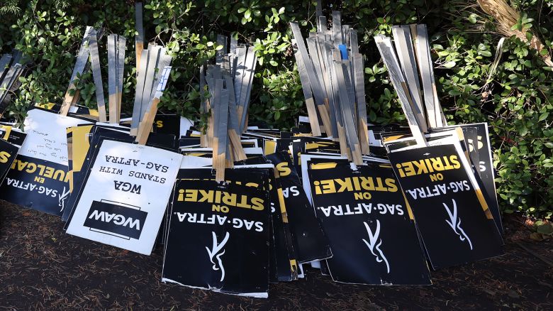 Protest signs are seen at the picket line outside Warner Bros. Studios on November 08, 2023 in Burbank, California. SAG-AFTRA has been on strike since July 14, 2023 and has not yet reached a deal with AMPTP, the trade association representing the Hollywood Studios.