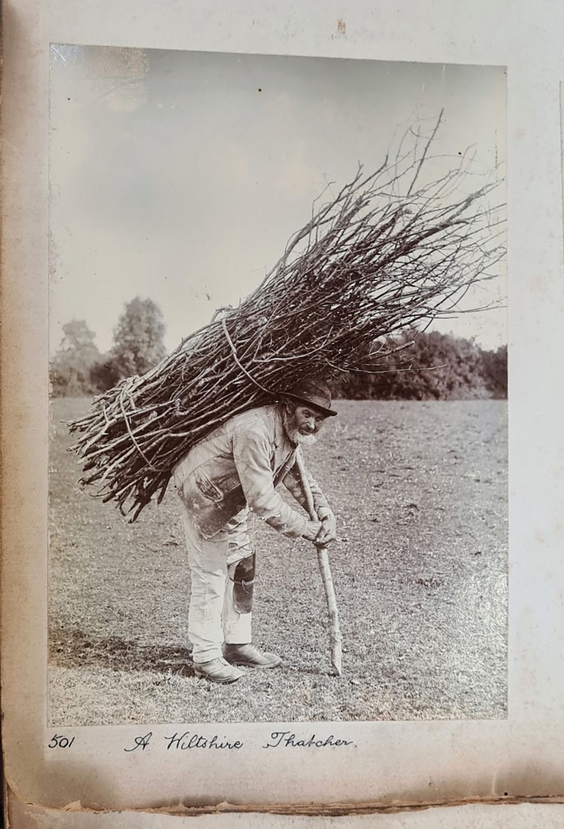 The original black and white photograph of the "Stick Man," now known to be a Wiltshire thatcher, was rediscovered by a research fellow at the University of the West of England.