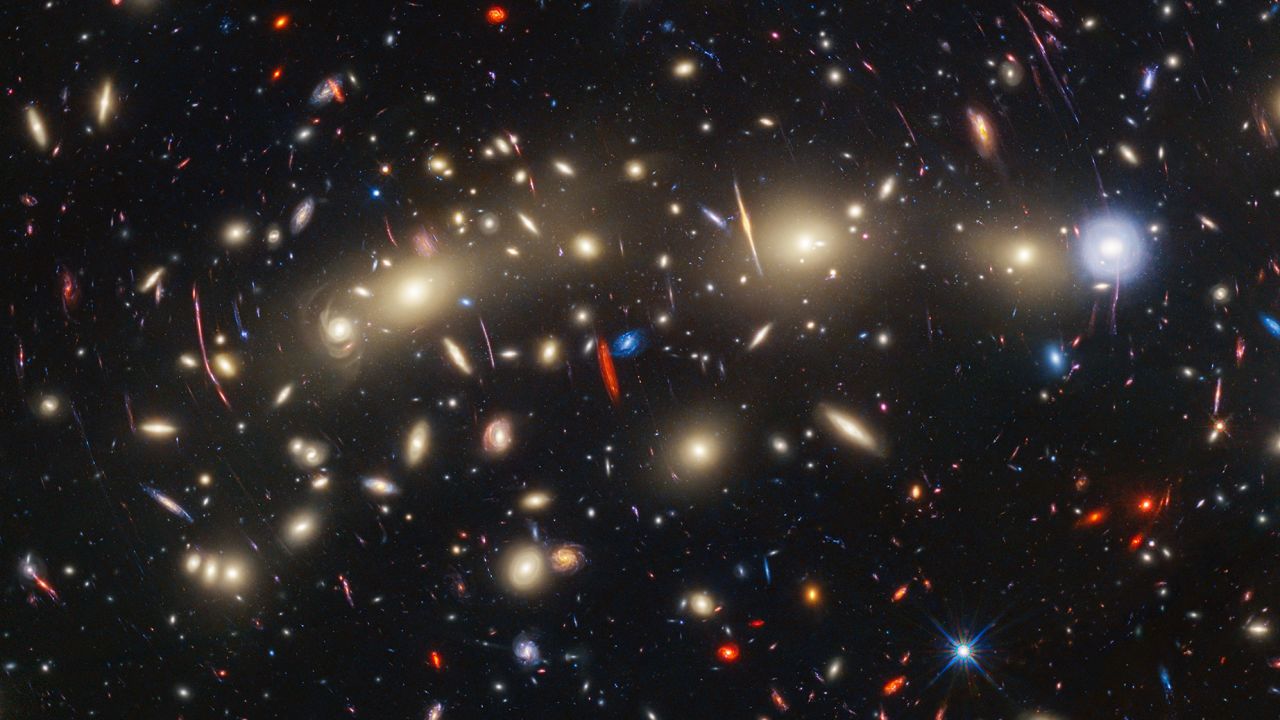 This panchromatic view of galaxy cluster MACS0416 was created by combining infrared observations from NASA's James Webb Space Telescope with visible-light data from NASA's Hubble Space Telescope. To make the image, in general the shortest wavelengths of light were color-coded blue, the longest wavelengths red, and intermediate wavelengths green. The resulting wavelength coverage, from 0.4 to 5 microns, reveals a vivid landscape of galaxies that could be described as one of the most colorful views of the universe ever created.