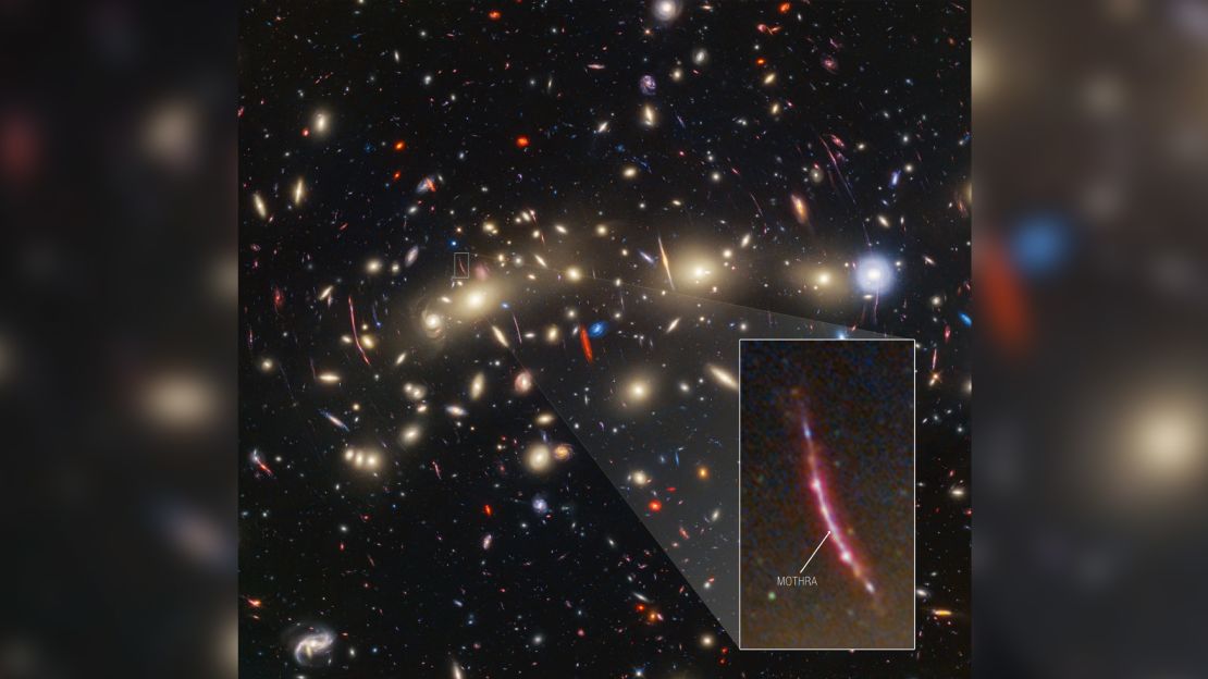 This image of galaxy cluster MACS0416 highlights one particular gravitationally lensed background galaxy, which existed about 3 billion years after the big bang. That galaxy contains a transient, or object that varies in observed brightness over time, that the science team nicknamed "Mothra." Mothra is a star that is magnified by a factor of at least 4,000 times. The team believes that Mothra is magnified not only by the gravity of galaxy cluster MACS0416, but also by an object known as a "milli-lens" that likely weighs about as much as a globular star cluster.