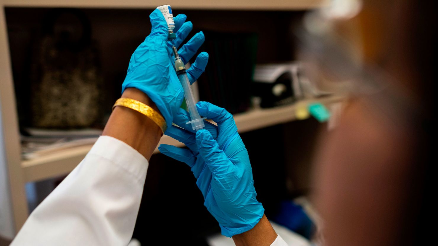 This picture taken on April 5, 2019 shows a nurse preparing the measles, mumps and rubella vaccine at the Rockland County Health Department in Haverstraw, Rockland County, New York. - A measles outbreak in the area has sickened scores of people and caused the county to bar unvaccinated minors in public places. (Photo by Johannes EISELE / AFP) / With AFP Story by Catherine TRIOMPHE: NY county measles outbreak spotlights vaccine religious exemptions        (Photo credit should read JOHANNES EISELE/AFP via Getty Images)
