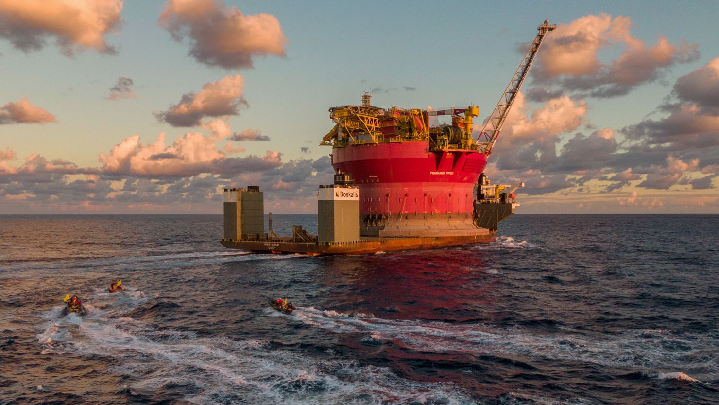 GRAN CANARIA, SPAIN - JANUARY 31: Greenpeace activists speed towards and board a Shell oil platform being transported by the White Marlin ship on January 31, 2023 in the Atlantic Ocean north of Gran Canaria, Spain. Greenpeace activists from Argentina, Turkey, the US and the UK have boarded and occupied the Shell oil platform en route to a major oilfield in the North Sea with the message: STOP DRILLING. START PAYING. Just two days ahead of Shells profits announcement, four Greenpeace International activists boarded the White Marlin vessel at sea north of the Canary Islands in a peaceful protest against the climate devastation around the world caused by Shell and the wider fossil fuel industry, without paying a penny towards loss and damage. (Photo by Handout/Getty Images)