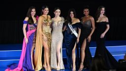 (L-R) Miss Universe 2018 Catriona Gray, Miss Universe 2020 Andrea Meza, CEO of JKN Global Group Jakapong Anne Jakrajutatip, Miss Universe 2021 Harnaaz Sandhu, Miss Universe 2011 Leila Lopes and Miss Universe 2005 Natalie Glebova stand on stage together during the Miss Universe Extravaganza, after JKNs acquisition of the Miss Universe franchise, in Bangkok on November 7, 2022. (Photo by Lillian SUWANRUMPHA / AFP) (Photo by LILLIAN SUWANRUMPHA/AFP via Getty Images)