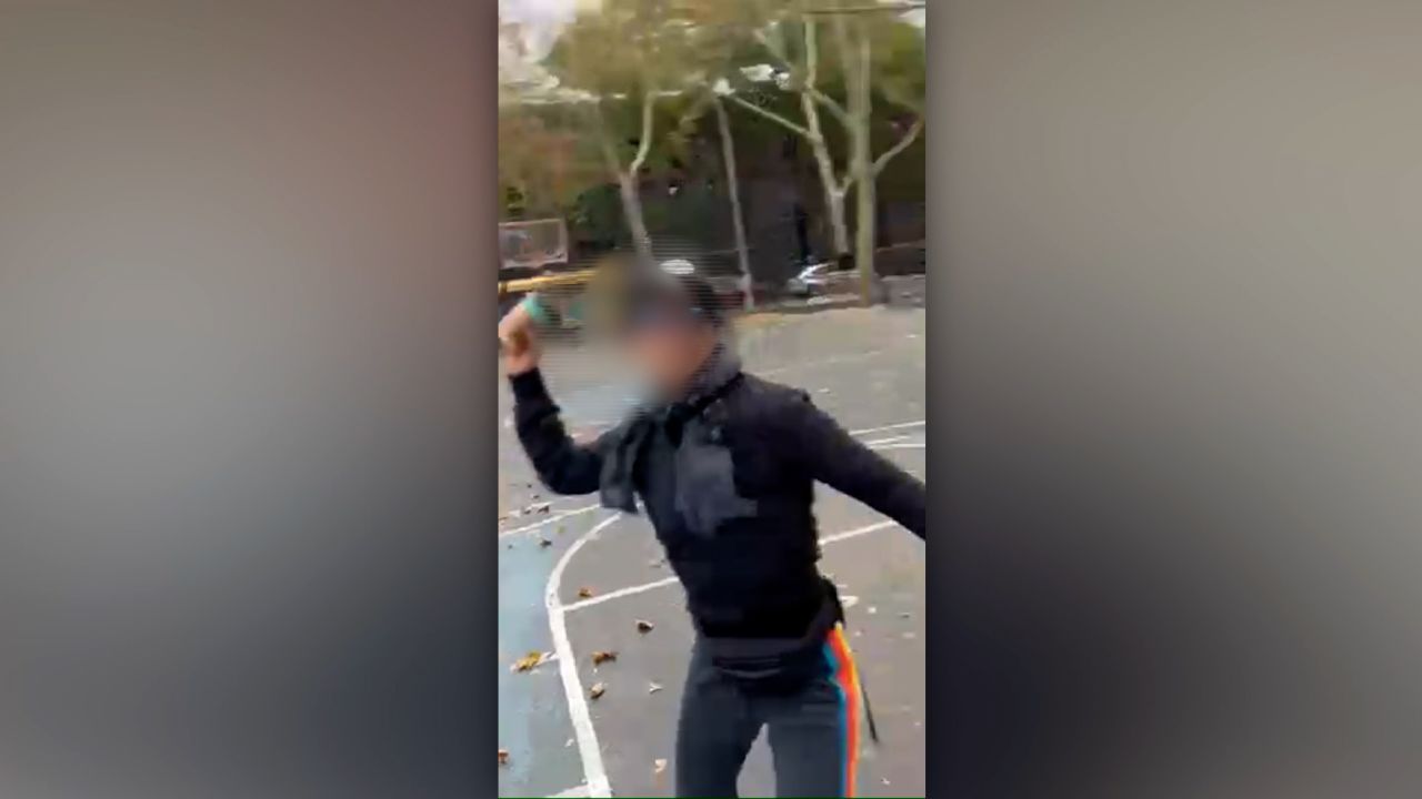 This screengrab, from a video captured by Ashish Prashar, appears to show a woman throwing a disposable coffee cup at Prashar. CNN blurred a portion of the image.