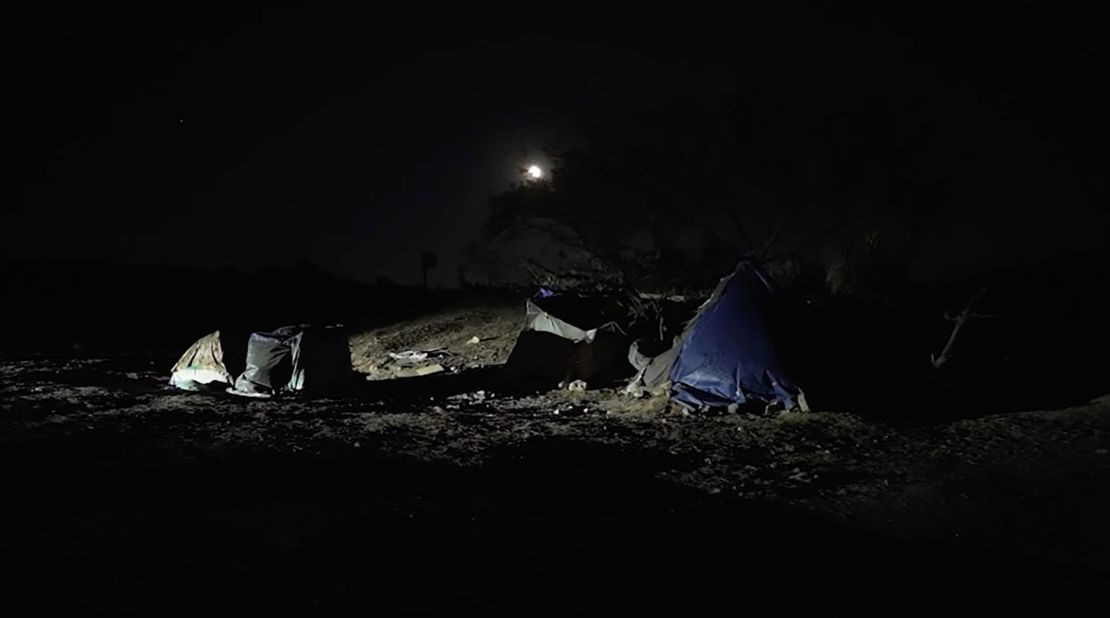 Tents and trash are seen on Shuster's property left behind by migrants.