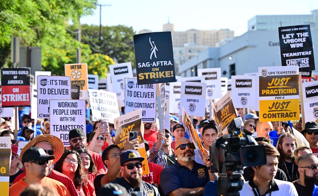 Members of the Writers Guild of America join UPS Teamsters during a rally ahead of possible UPS strike, in Los Angeles, California, on July 19, 2023. The current UPS contract expires July 31. The Teamsters represent about 340,000 workers, meaning a strike would be the biggest in decades. (Photo by Frederic J. BROWN / AFP) (Photo by FREDERIC J. BROWN/AFP via Getty Images)