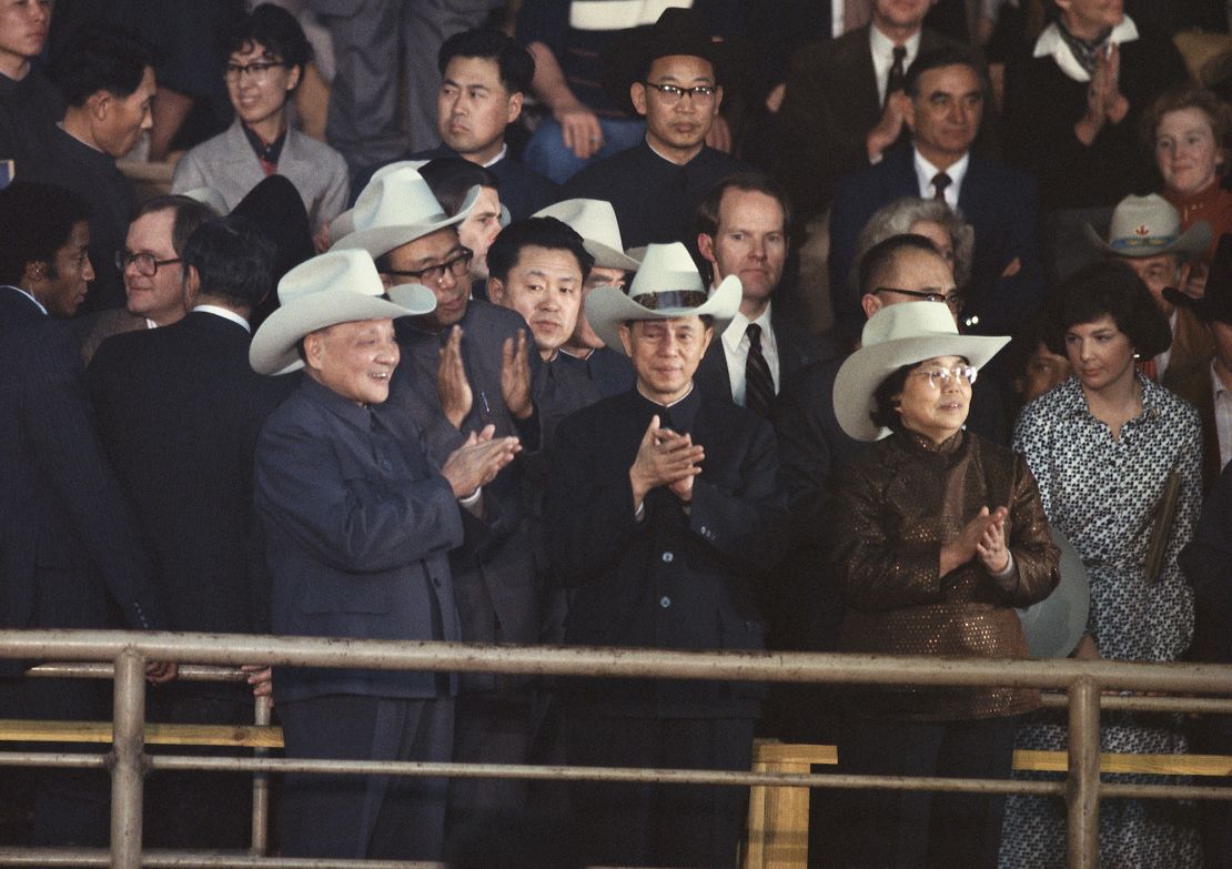 Peoples Republic of China leader Deng Xiaoping, wearing a cowboy hat, applauds at a Houston rodeo during a U.S. State visit, 1979. (Photo by Wally McNamee/Corbis via Getty Images)