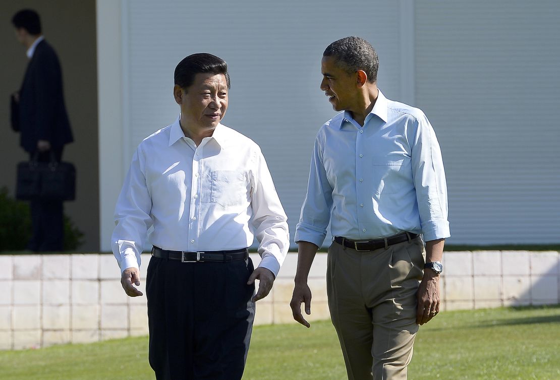 US President Barack Obama (R) and Chinese President Xi Jinping chat as they take a walk at the Annenberg Retreat at Sunnylands in Rancho Mirage, California, on June 8, 2013. Obama and Xi wrap up their debut summit Saturday, grasping for a personal understanding that could ease often prickly US-China relations. Skipping the usual summit pageantry, Obama and Xi went without neckties, in a departure from the stifling formality that marked Obama's halting interactions with China's ex-president Hu Jintao. AFP PHOTO/Jewel Samad (Photo credit should read JEWEL SAMAD/AFP via Getty Images)