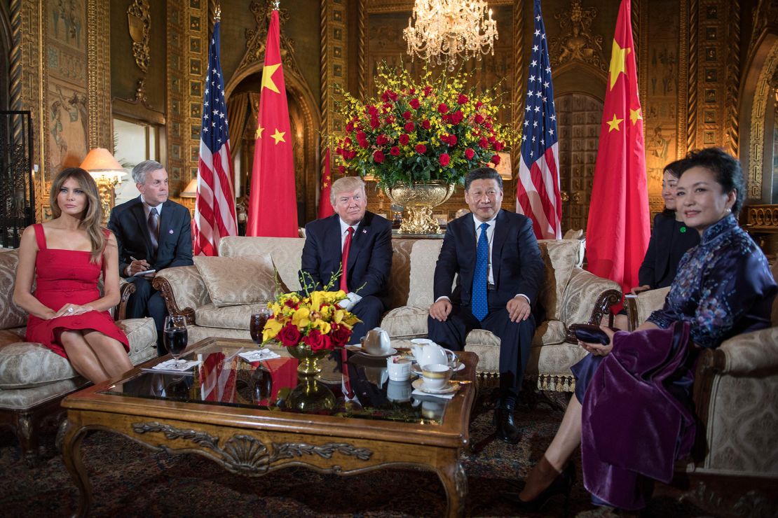 US First Lady Melania Trump (L) and US President Donald Trump (3rd L) pose with Chinese President Xi Jinping (2nd R) and his wife Peng Liyuan (R) upon their arrival to the Mar-a-Lago estate in West Palm Beach, Florida, on April 6, 2017. (Photo by JIM WATSON / AFP) (Photo by JIM WATSON/AFP via Getty Images)