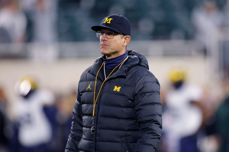 Big Ten conference bans Michigan football head coach Jim Harbaugh