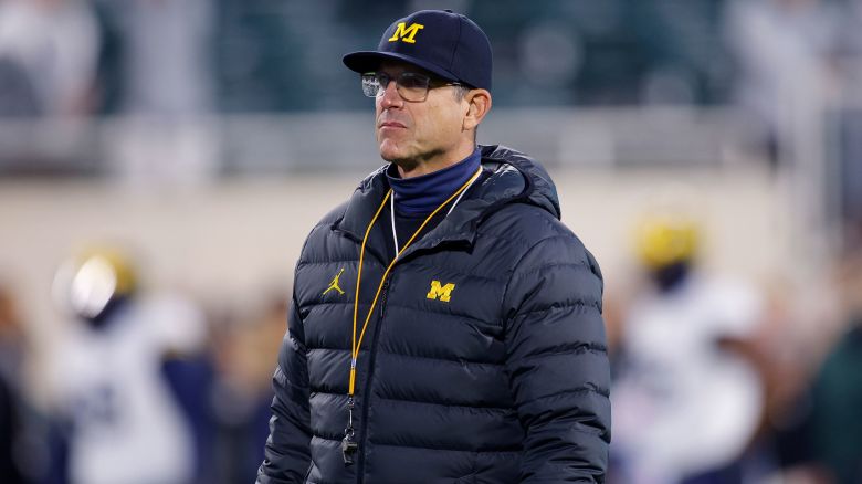 Michigan coach Jim Harbaugh watches during warmups before an NCAA college football game against Michigan State, Saturday, Oct. 21, 2023, in East Lansing, Mich. (AP Photo/Al Goldis)