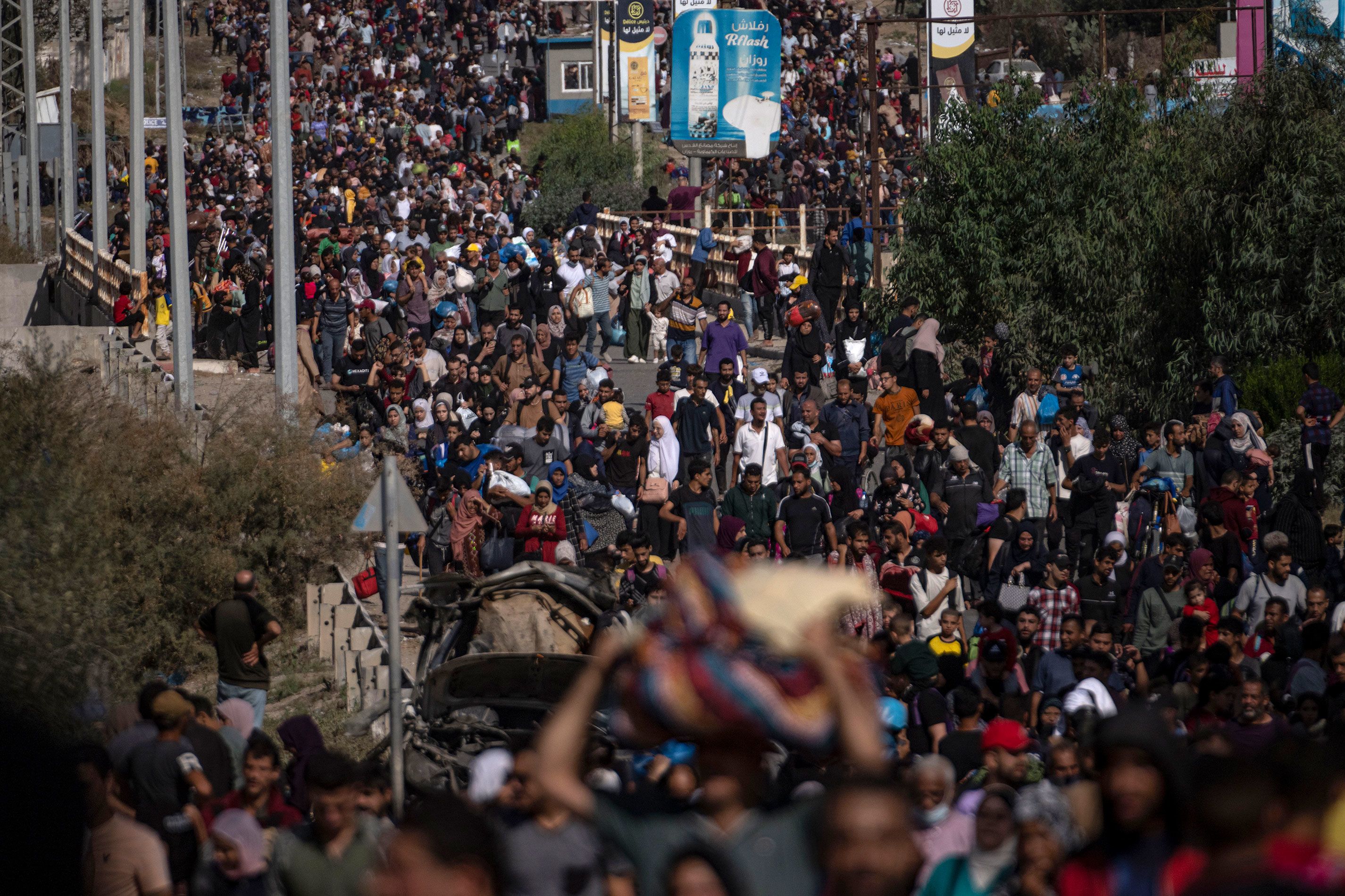 Palestinians flee to southern Gaza on Salah al-Din Street in Bureij, Gaza, on November 10.