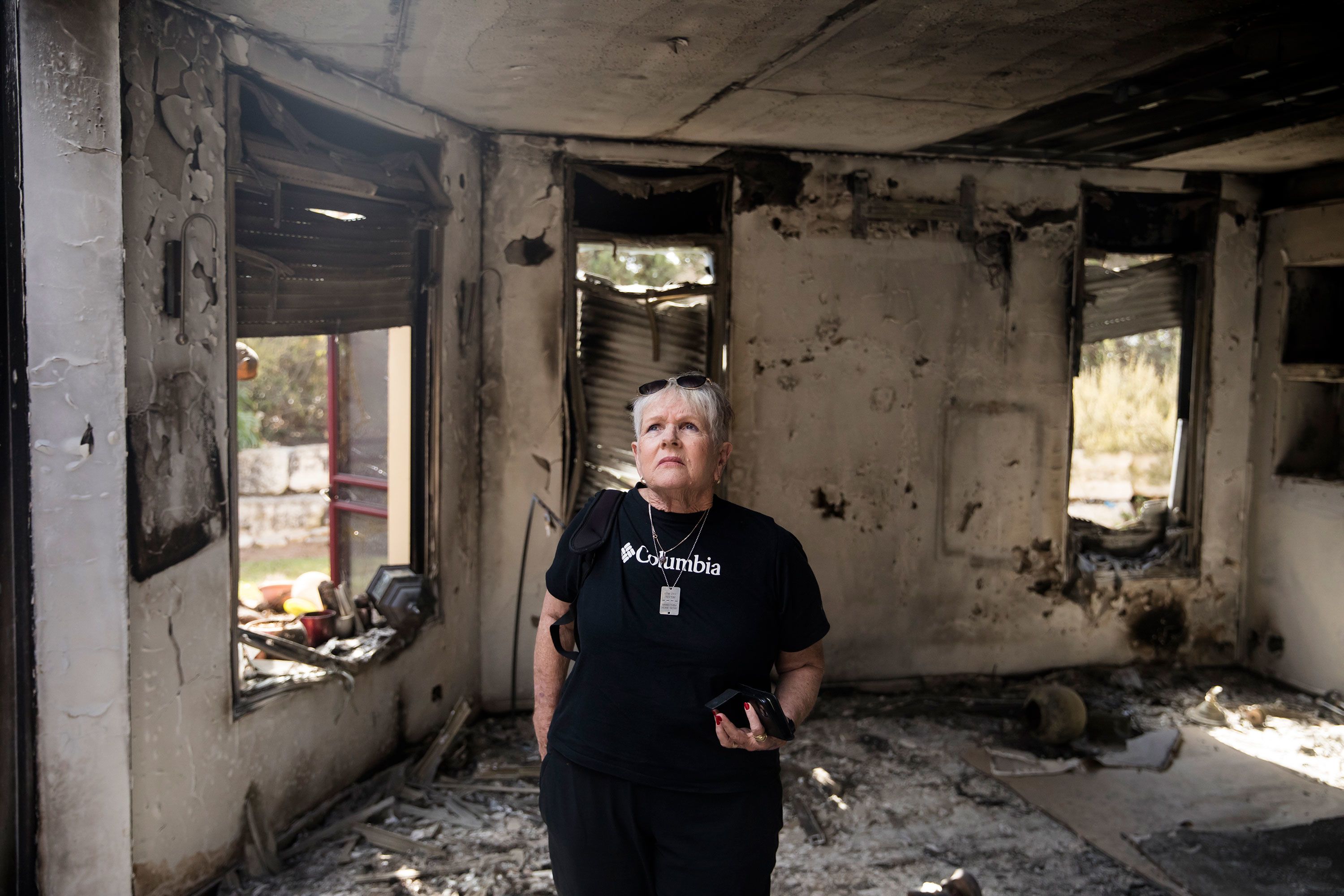 Varda Goldstein enters her house for the first time after it was burned in the October 7 Hamas attack in Kfar Aza, Israel, on November 10.