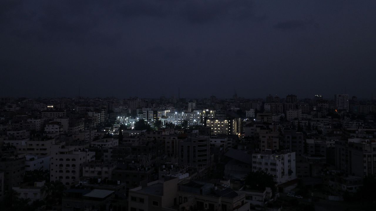 Al Shifa hospital is lit up in Gaza City amid fuel shortages on October 24.