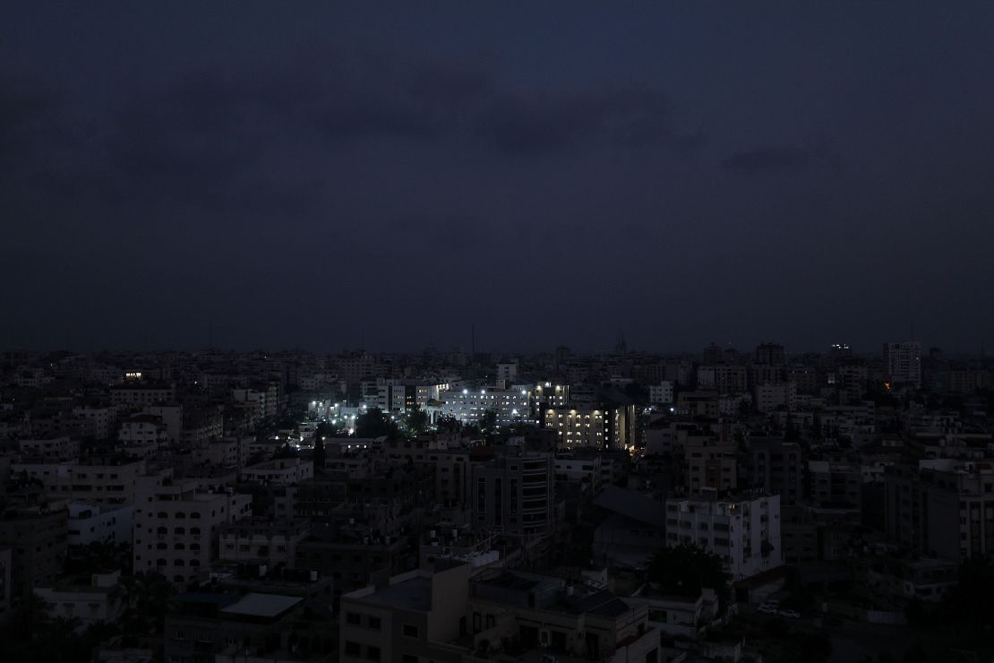 Al Shifa hospital is lit up in Gaza City amid fuel shortages on October 24.