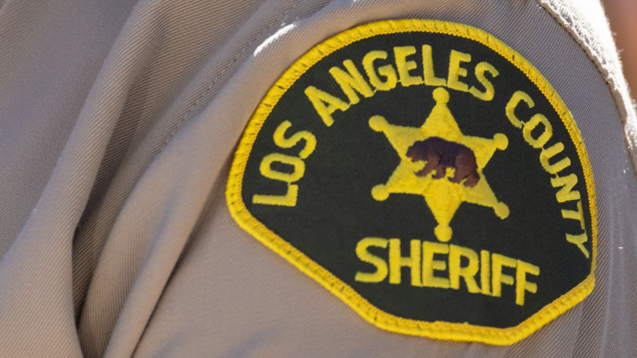 PALMDALE, CA - SEPTEMBER 18: Los Angeles County Sheriff Robert Luna wears a black band over his badge in memory of Dep. Ryan Clinkunbroomer who was shot to death Saturday evening. The Sheriff announced the arrest of a suspect Monday morning Sept. 18, 2023. (Myung J. Chun / Los Angeles Times via Getty Images)
