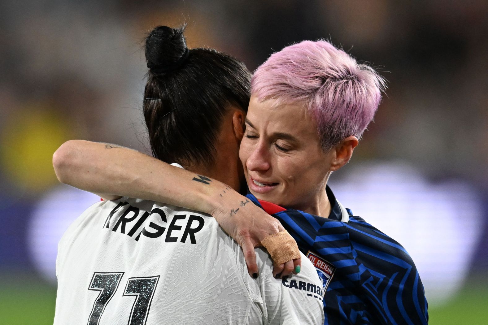 Rapinoe hugs Gotham FC's Ali Krieger during the National Women's Soccer League final match in San Diego in November 2023. Rapinoe<a href="index.php?page=&url=https%3A%2F%2Fwww.cnn.com%2F2023%2F11%2F11%2Fsport%2Fmegan-rapinoe-ali-krieger-nwsl-final-spt-intl%2Findex.html" target="_blank"> limped out of the final game of her storied career</a>, suffering an apparent ankle injury less than three minutes into the match. Krieger, another US soccer legend and Rapinoe's longtime teammate on the US Women's National Team, also announced her retirement from professional soccer at the end of the 2023 NWSL season.