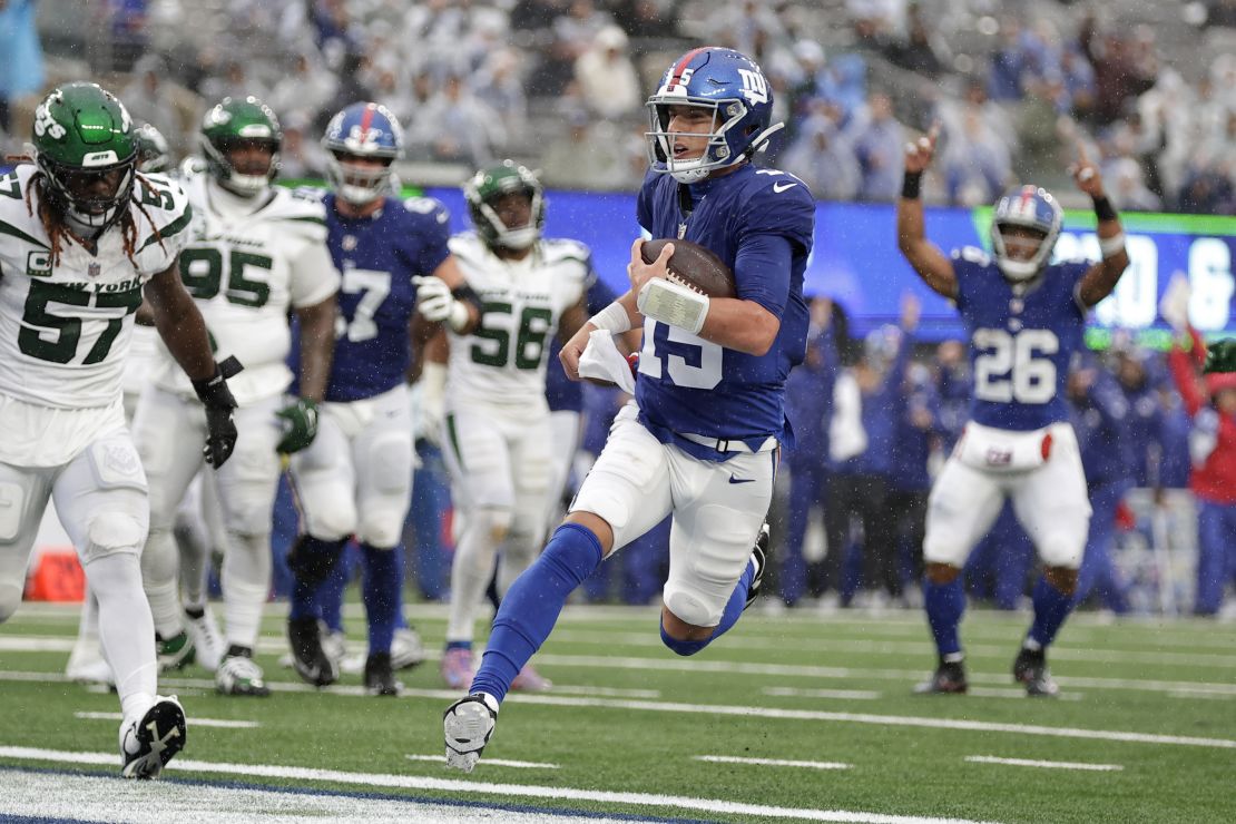 New York Giants quarterback Tommy DeVito (15) runs in a touchdown during the second half of an NFL football game against the New York Jets, Sunday, Oct. 29, 2023, in East Rutherford, N.J. (AP Photo/Adam Hunger)