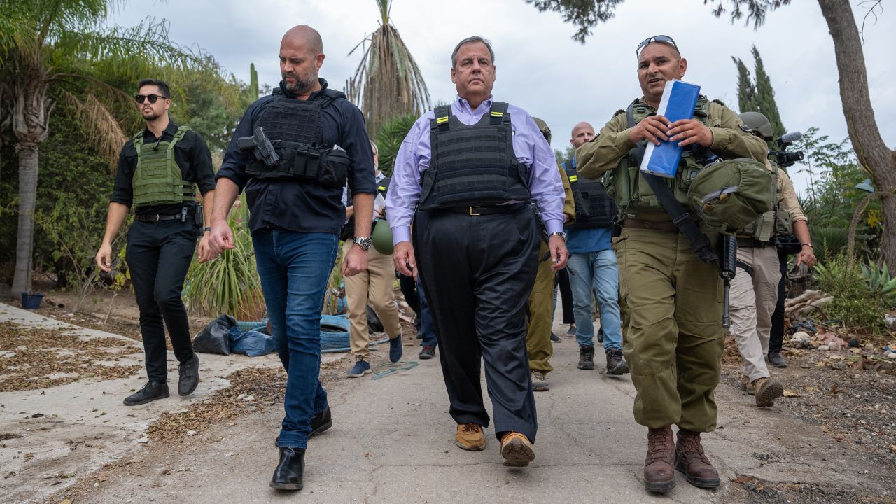 Republican Presidential candidate, former New Jersey Gov. Chris Christie (C) led by IDF Spokesperson Maj. Liad Diamond (R), and Amir Ohana (L), Speaker of the Knesset, visits Kibbutz Kfar Aza which was attacked by Hamas on Oct. 7 near the Gaza Border on November 12, 2023 in Kfar Aza, Israel. The former New Jersey governor, who is running for the Republican nomination in next year's presidential race, is visiting the country in the wake of the October 7 attacks by Hamas that left an estimated 1,200 dead and over 240 kidnapped, according to Israeli authorities.